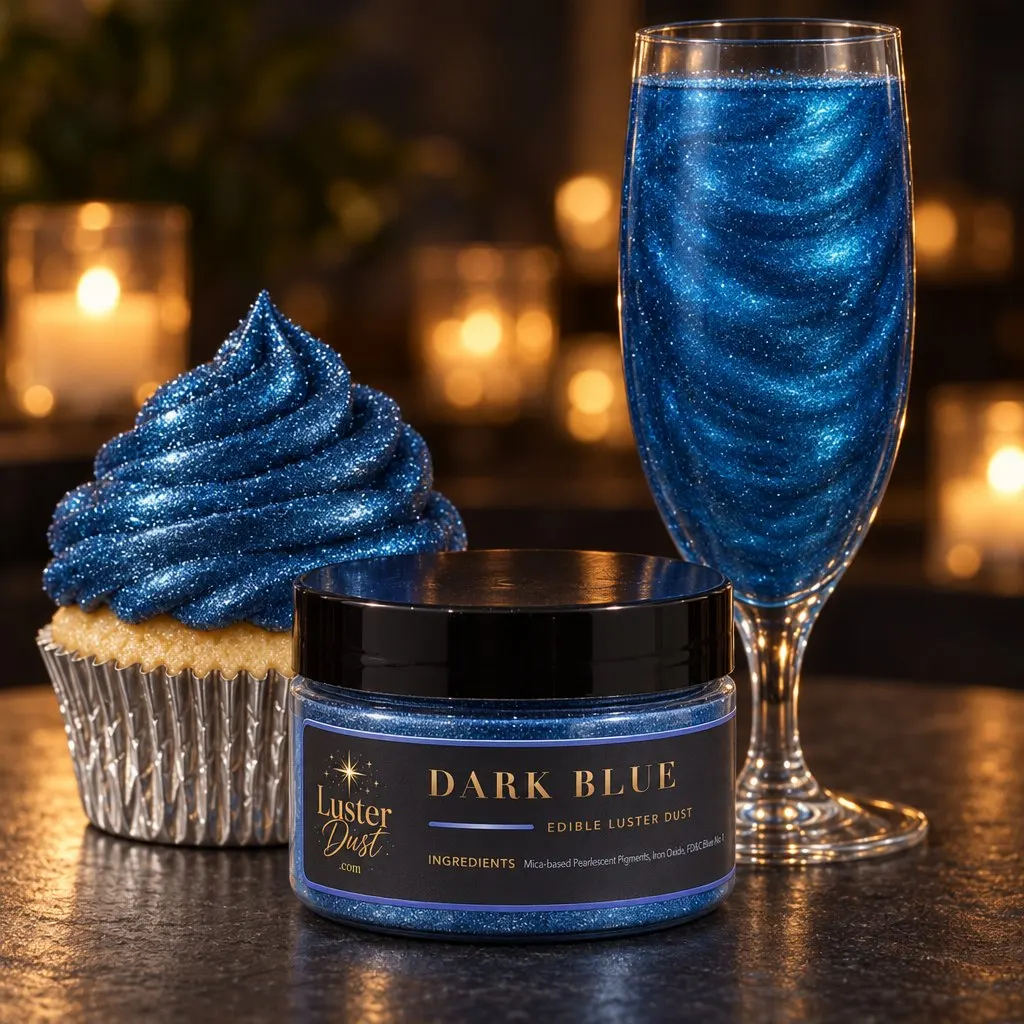Dark Blue glitter drink in a champagne flute with a jar of dark blue luster dust and a cupcake topped with dark blue edible glitter on a candlelit table