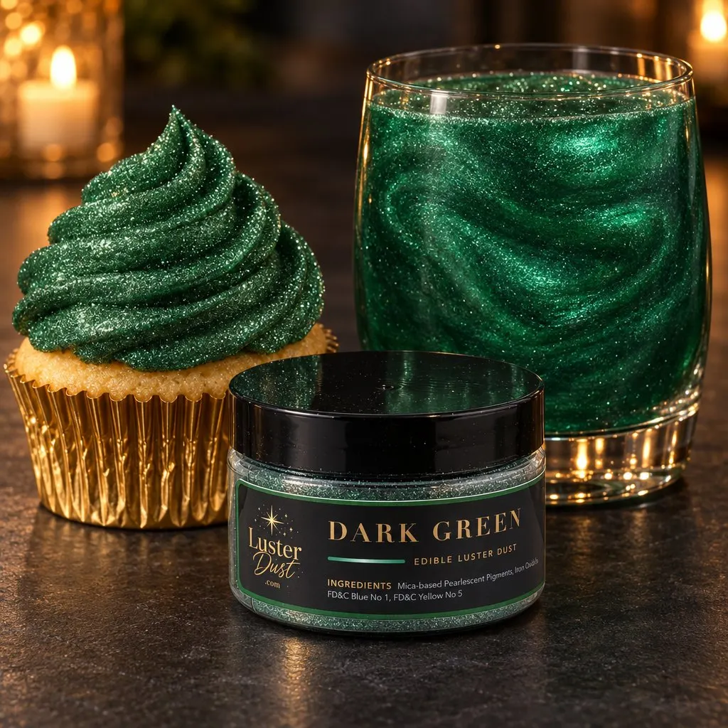 Dark Green glitter drink in a rocks glass with a jar of dark green luster dust and a cupcake topped with dark green edible glitter on a candlelit table