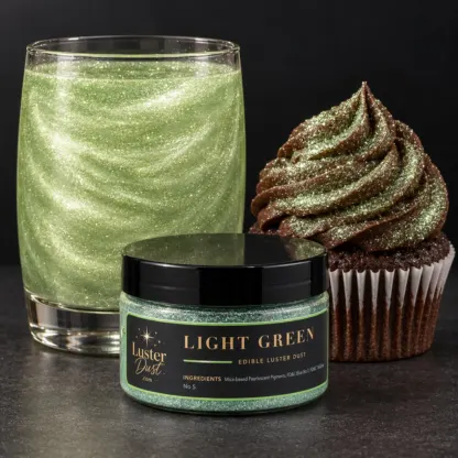 Light Green edible luster dust in a 50 g jar beside a light green glitter drink and a cupcake coated in light green edible glitter