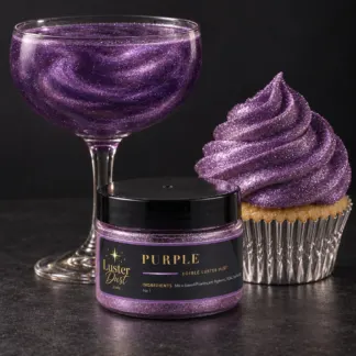 Purple edible luster dust in a 50 g jar beside a purple glitter drink and a cupcake coated in purple edible glitter